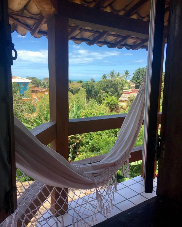 Novos Baianos Hostel E Pousada Porto Seguro Exterior photo Hammock in a hotel in San Juan del Sur, Nicaragua