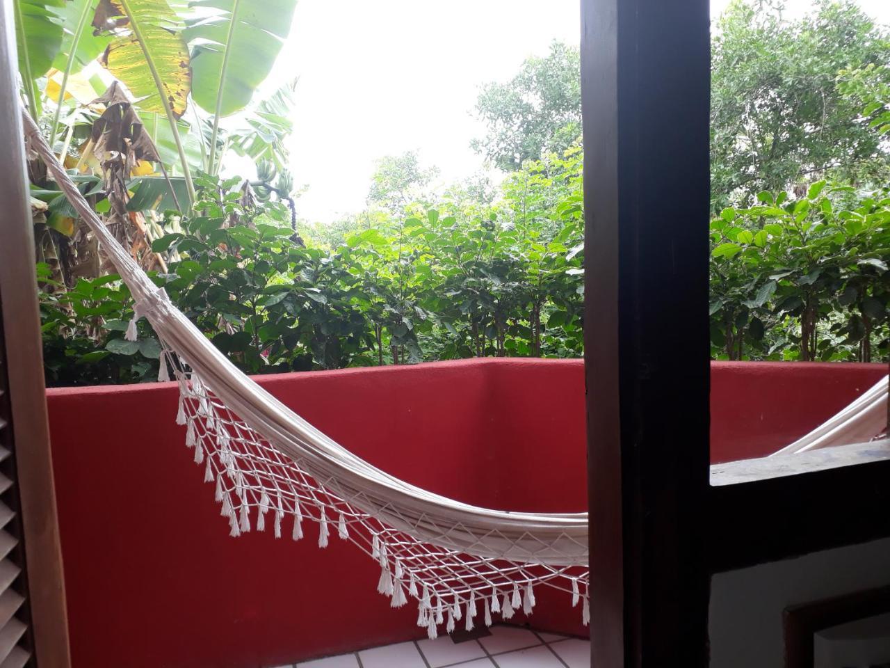 Novos Baianos Hostel E Pousada Porto Seguro Exterior photo A hammock on a balcony
